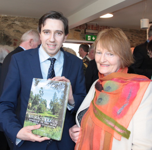 Megan O'Beirne presents her book to Minister Harris